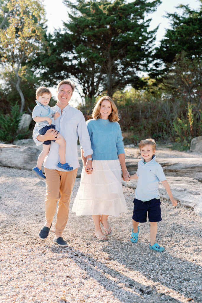 Coastal New England family portraits in Madison CT with soft breeze, sandy textures, and golden sunset light