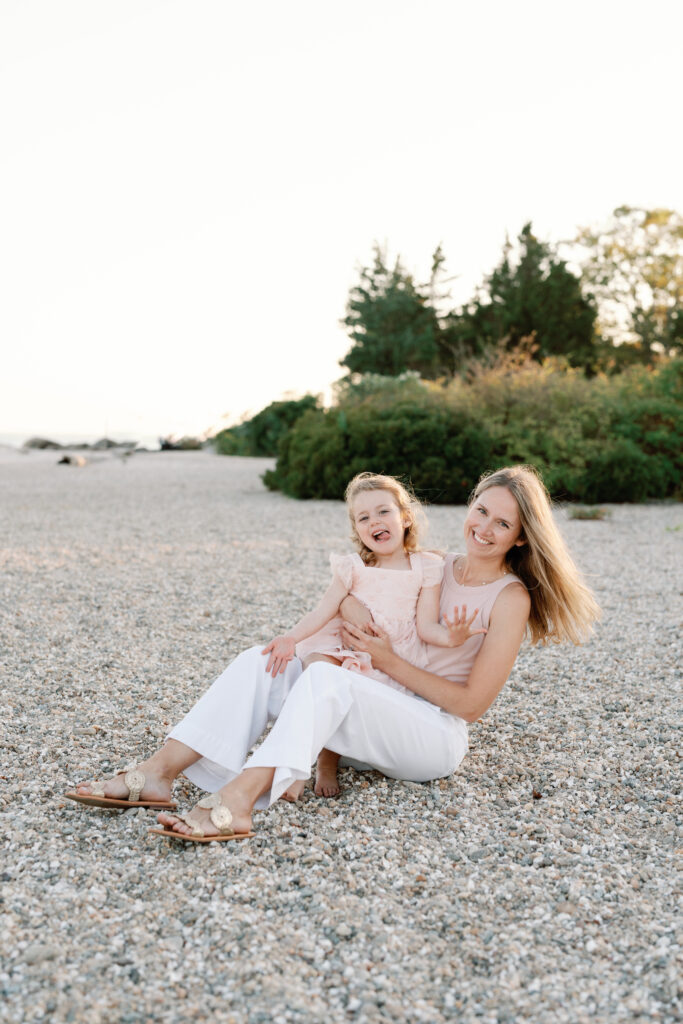 Lifestyle family photography session at Hammonasset Beach State Park featuring candid interaction and movement