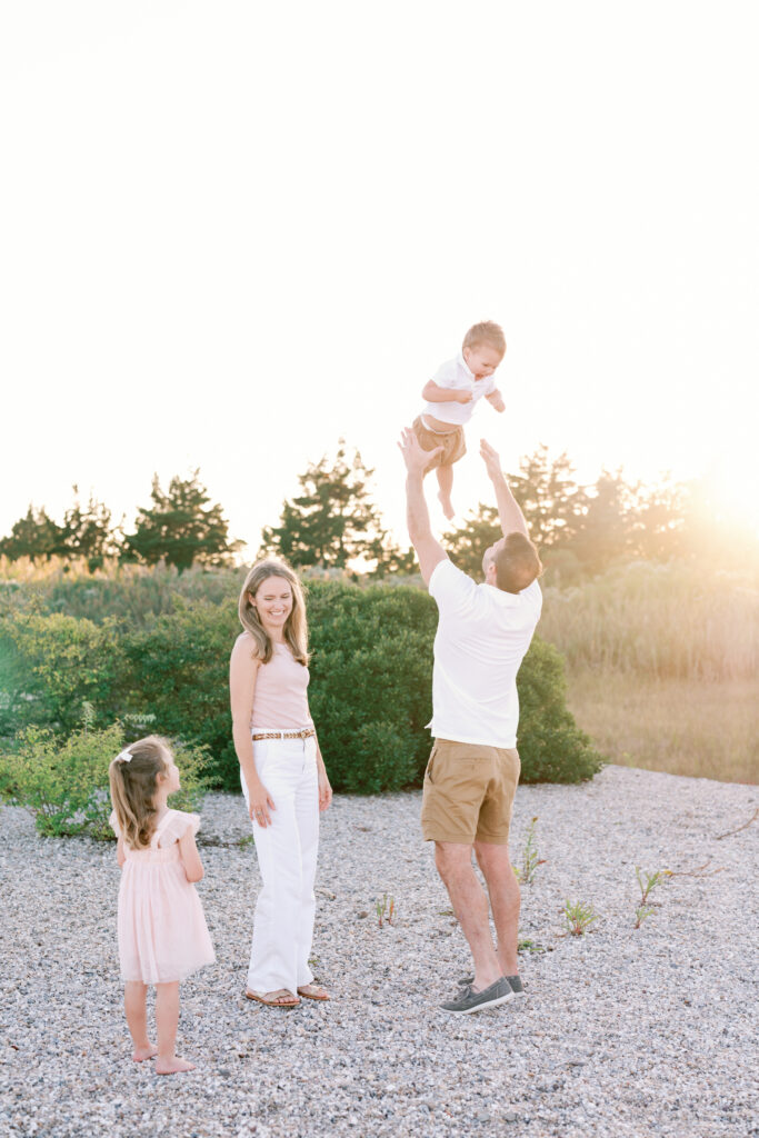 Lifestyle family photography session at Hammonasset Beach State Park featuring candid interaction and movement