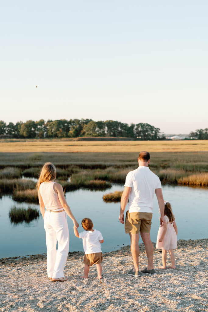 Lifestyle family photography session at Hammonasset Beach State Park featuring candid interaction and movement