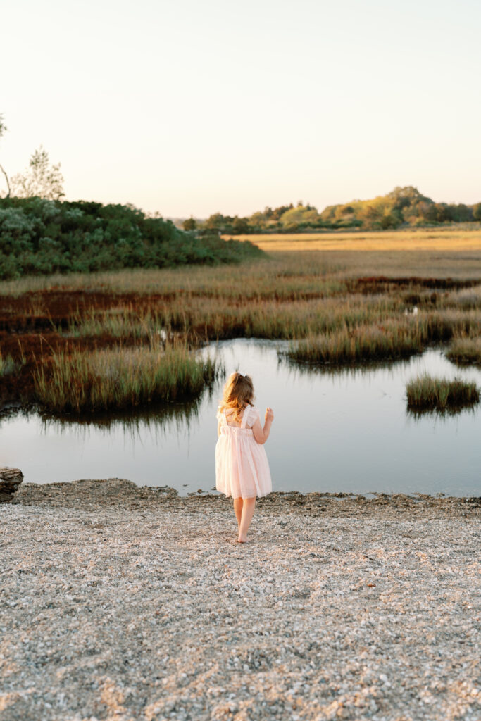 Lifestyle family photography session at Hammonasset Beach State Park featuring candid interaction and movement