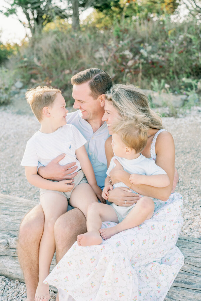 Lifestyle family photography session at Hammonasset Beach State Park featuring candid interaction and movement