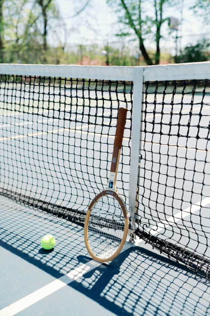 Lifestyle engagement photography in Connecticut capturing couple playing pickleball