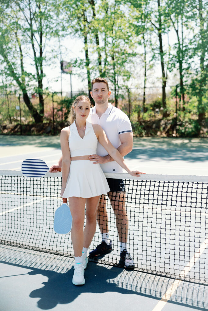 Romantic New England engagement photos of couple playing pickleball