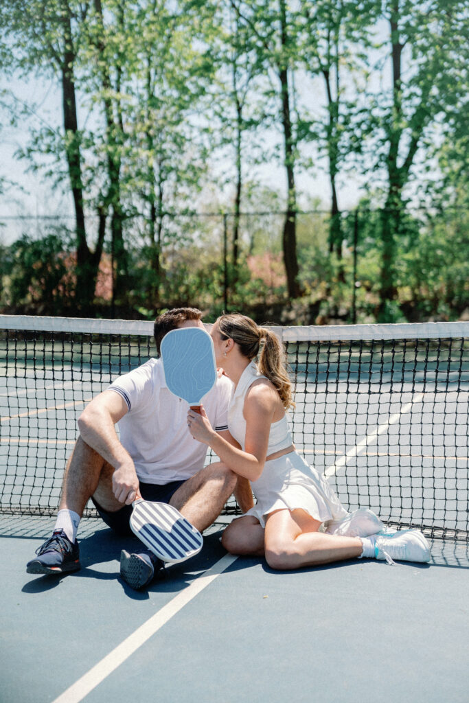 Romantic New England engagement photos of couple playing pickleball