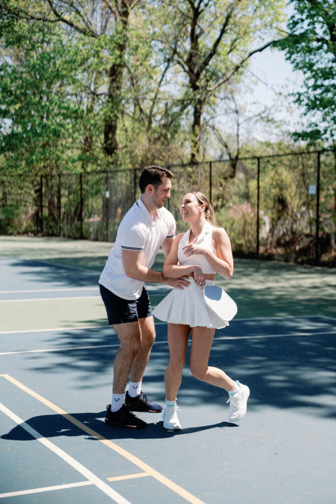 Romantic New England engagement photos of couple playing pickleball
