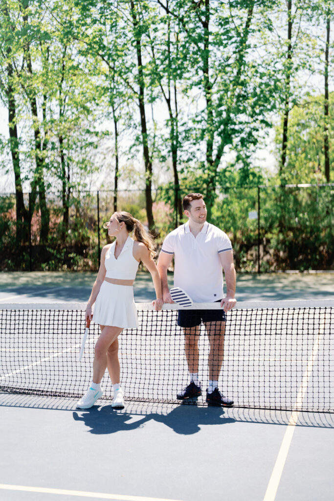 Fun and candid pickleball engagement session at Connecticut tennis and pickleball courts